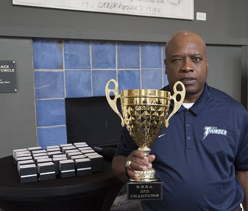 Darnell Booker with the 2021 World Series trophy