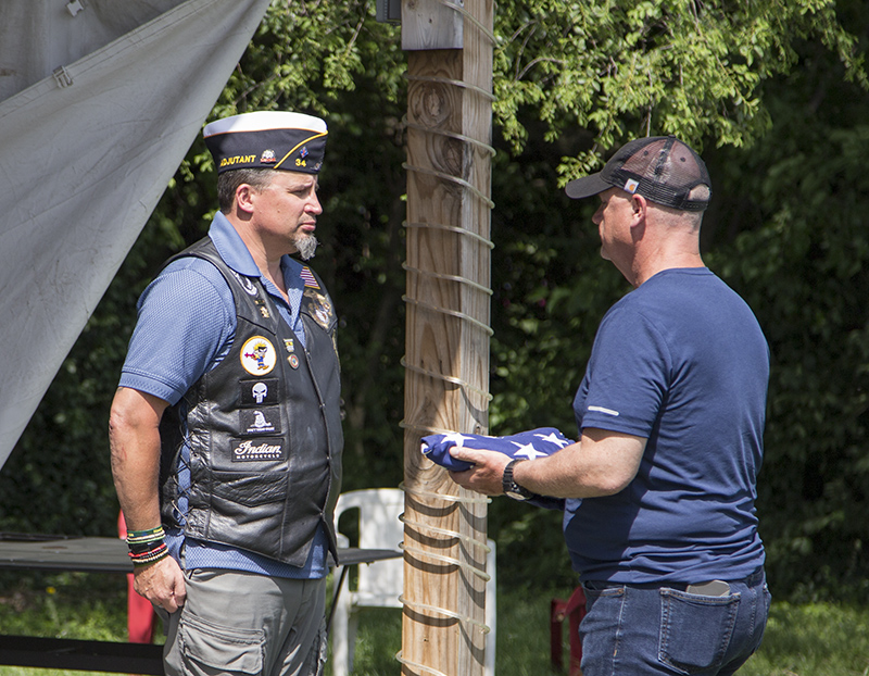 Presenting the unserviceable flags to United States Marine Corp (ret) Major Russell Johnson, Post 34 Adjutant