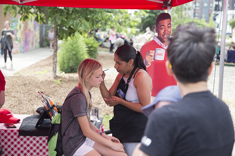 Face painting in the Broad Ripple State Farm tent