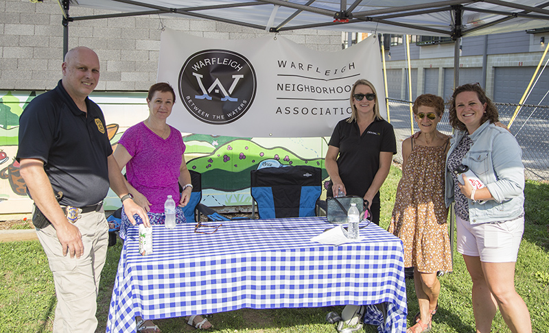 IMPD officer Michael Croddy (left) at the Warfleigh booth