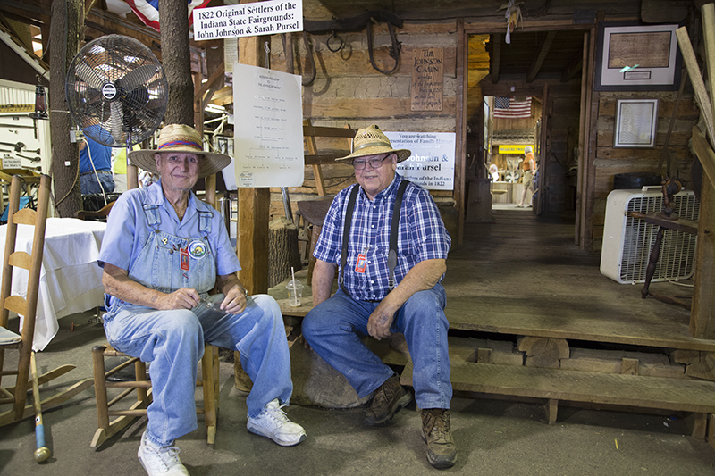 Two relatives of John Johnson and Sarah Pursel in front of the 1822 cabin replica in the Pioneer Building. This exhibit honors the cabin John and Sarah built on the land that later (in 1892) became the new (and current) Indiana State Fairgrounds (the old fairgrounds were at about 20th and Alabama). Pictured (L to R): Archie Kerr and Bill Tyner, cousins of your editor!