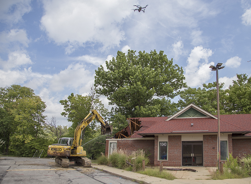 A drone can be seen recording the action for the construction company