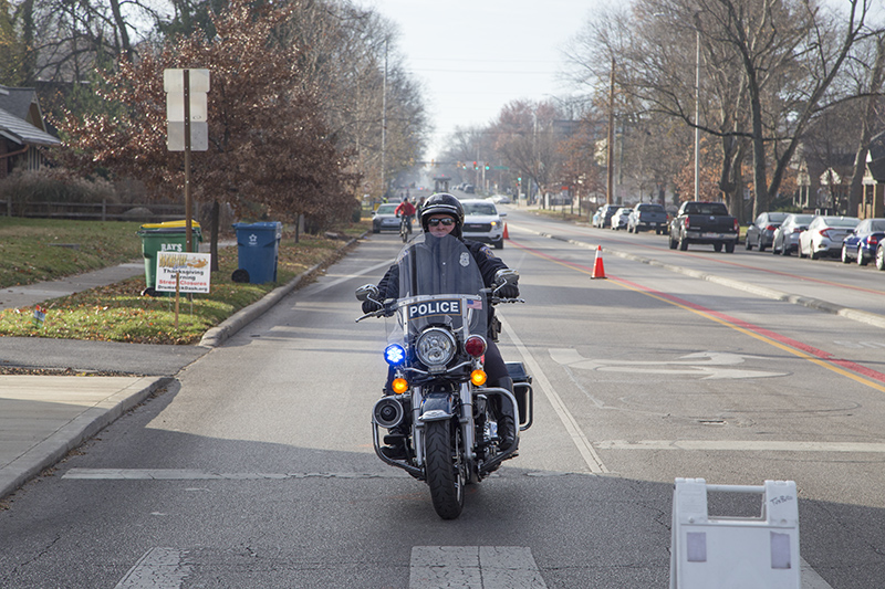 The police escort arrives at 61st and College Avenue