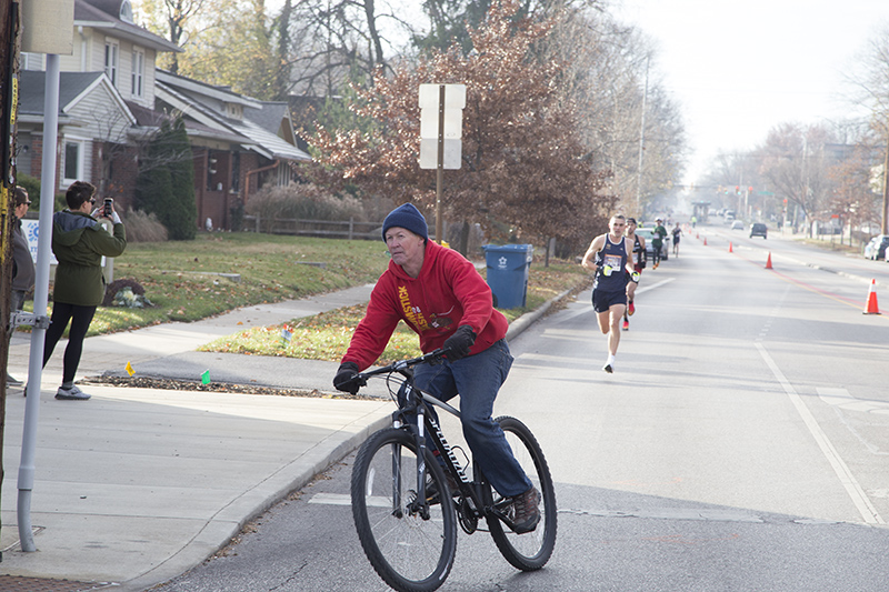 Don Carr of Tuxedo Brothers leads the runners on bike
