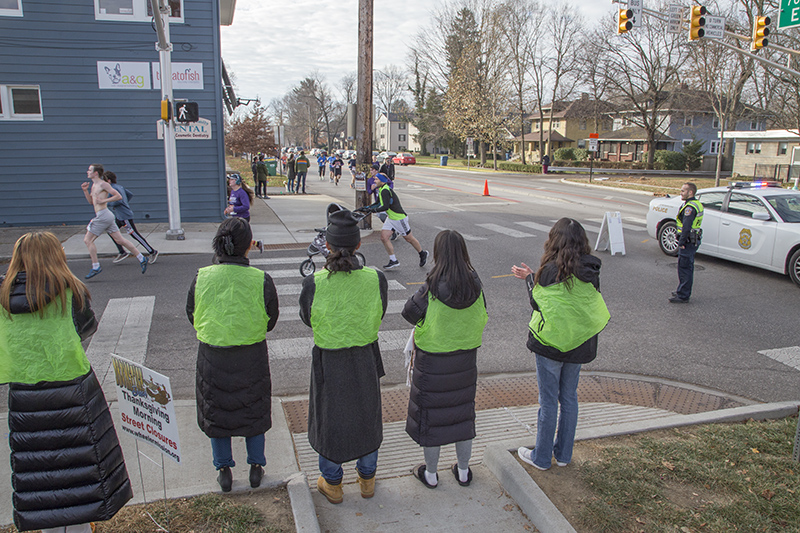 Pep squad at 61st Street cheering on the runners