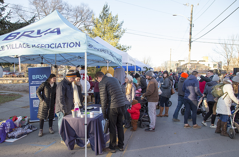 Activity booths lined Guilford Avenue across the Rainbow Bridge