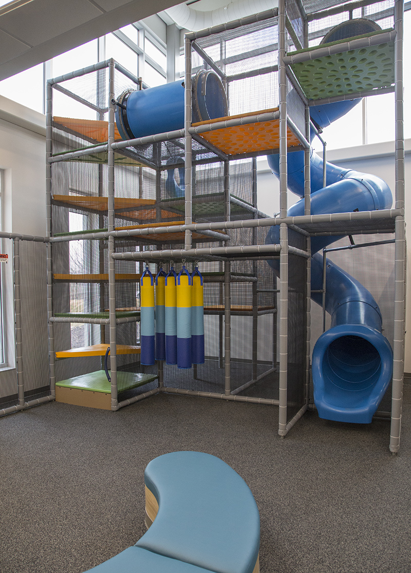 A two-story climbing gym is on the lower level next to the rentable party room