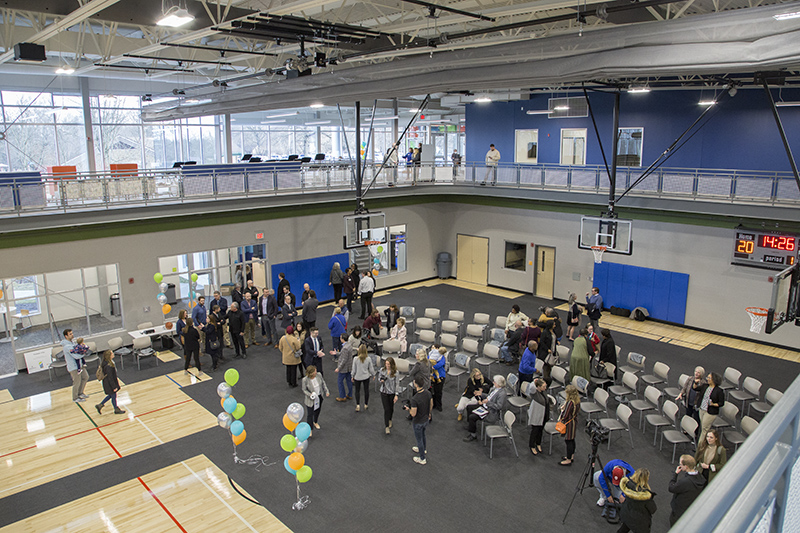 The ribbon cutting ceremony was set up on the basketball court