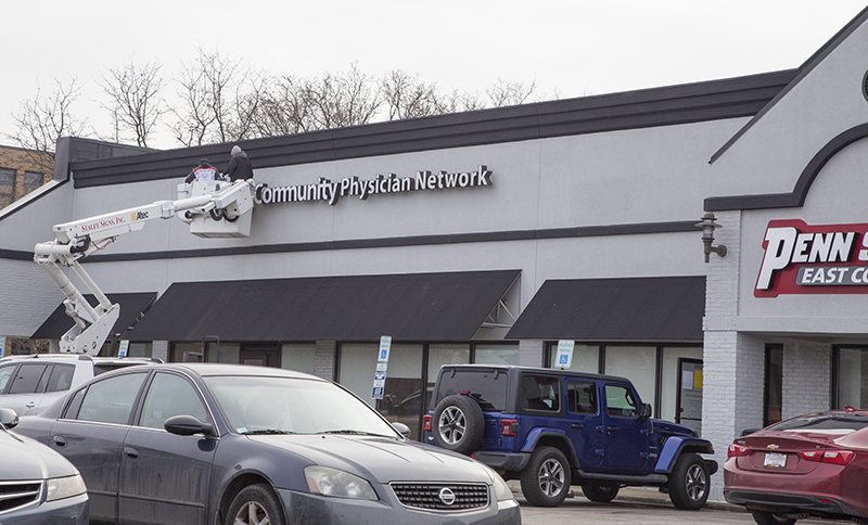 Random Rippling - Community Health sign coming down for move