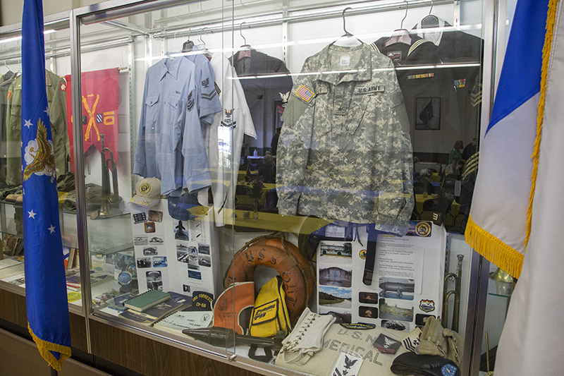 Display cases from many wars line the main hall