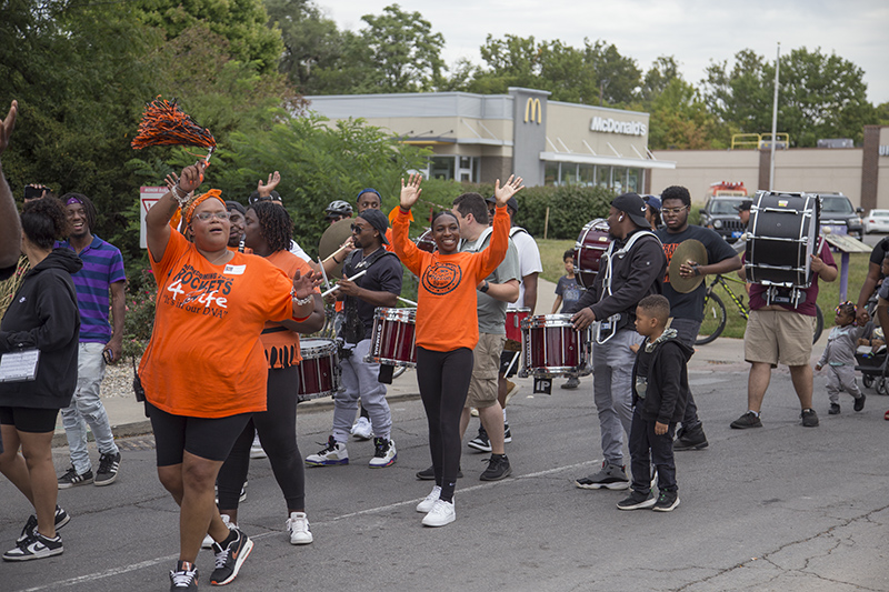 The marching band stopped in front of Cholita for a short performance