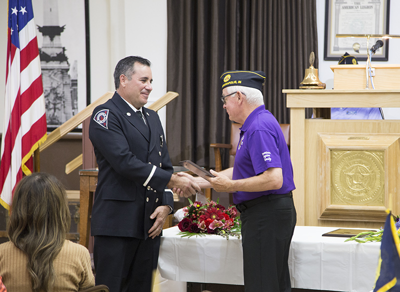 Post Commander Pete Holtz presents the award to Lieutenant Sean Chesebrough, Indianapolis Fire Department