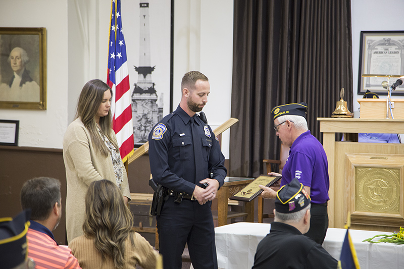 Post Commander Pete Holtz presents the award to Officer Tyler Colclazier, Indianapolis Metropolitan Police Department, North District