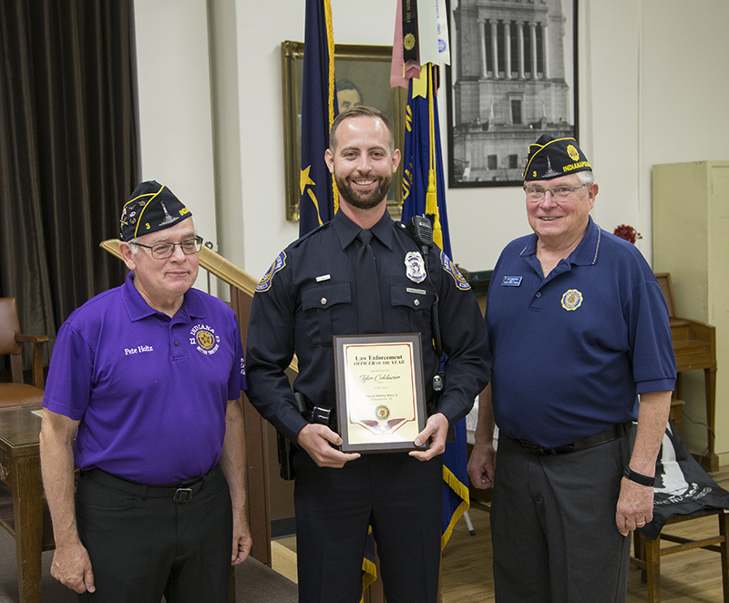 Post Commander Pete Holtz, Officer Tyler Colclazier, Indianapolis Metropolitan Police Department, North District and Finance Officer Dan Cunningham, PPC