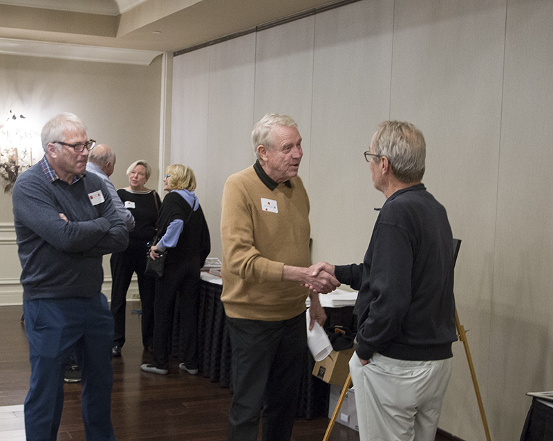 Steve Ring looks on as Jim Schroder (1968) greets Fritz Strack (1968)