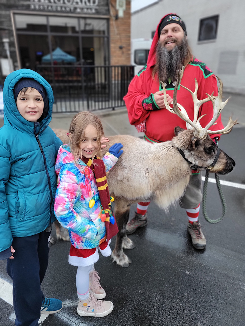 Attendees enjoyed time with one of Santa's reindeer at the Lights Up! event in the afternoon
