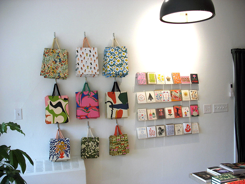 Gift bags and cards are available for sale at Golden Hour Books.
