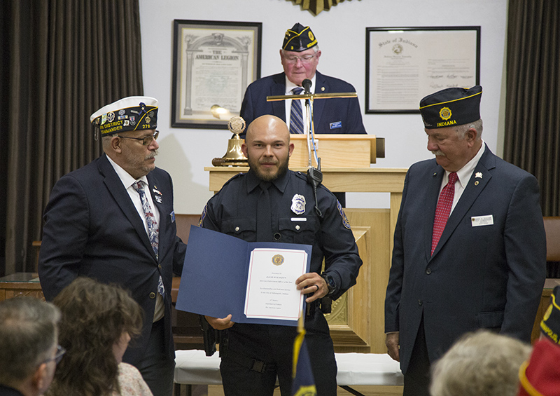 Robert Rowley, 11th District Commander and Mark Gullion, Past Commander Indiana, present the award to Officer David Woloszyn