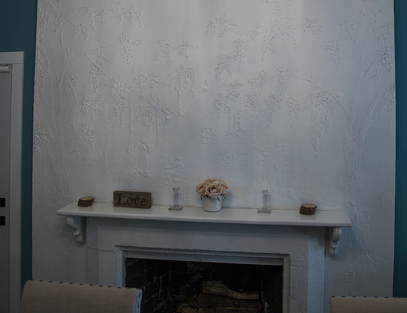 The original frieze with detailed images of people and trees
