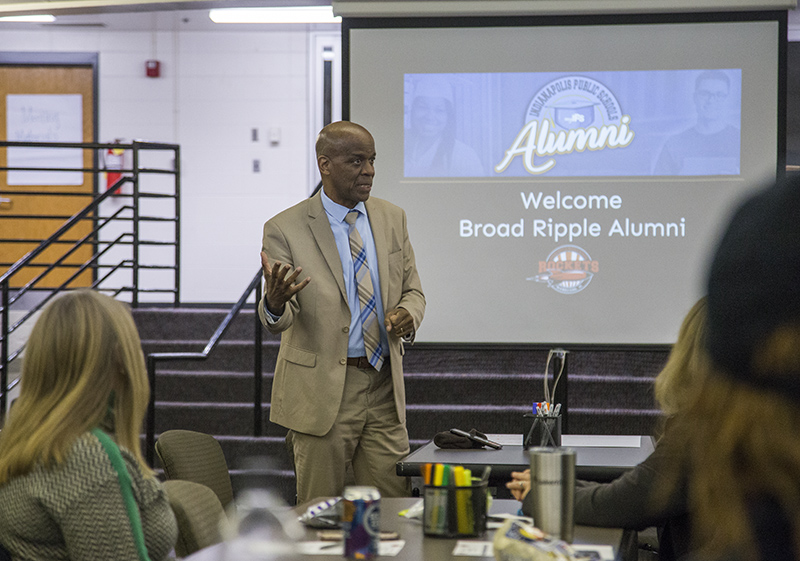 Curtis Baker, president of the BRHS Alumni Association, presenting at the middle school meeting