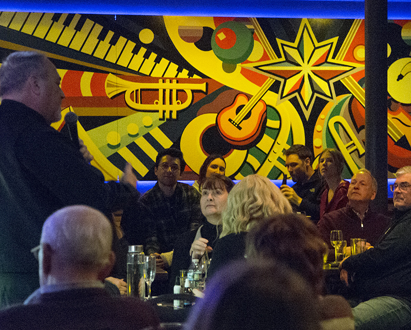 Band leader Tom Ewigleben talking to Bart Peterson, former mayor of Indianapolis, in the audience