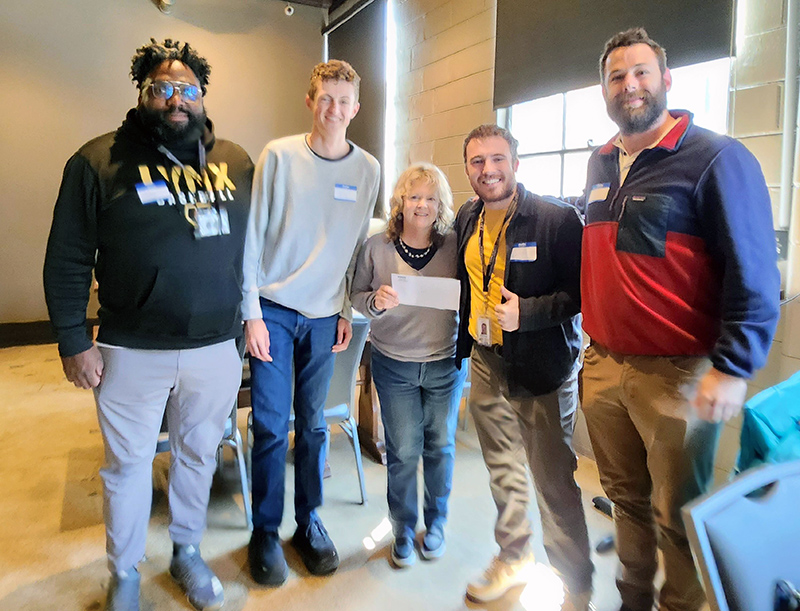Shy, the community outreach coordinator; Phillip, driver of the EV cart; and Coaches Conor Crittenden and Will Walls, and Annmarie Robertson of BRK