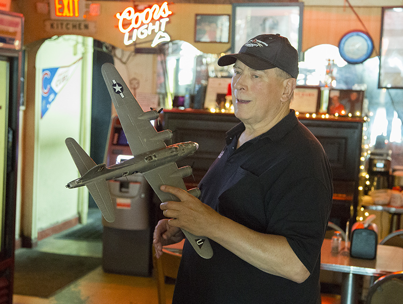 Bill Helbing with the restored model