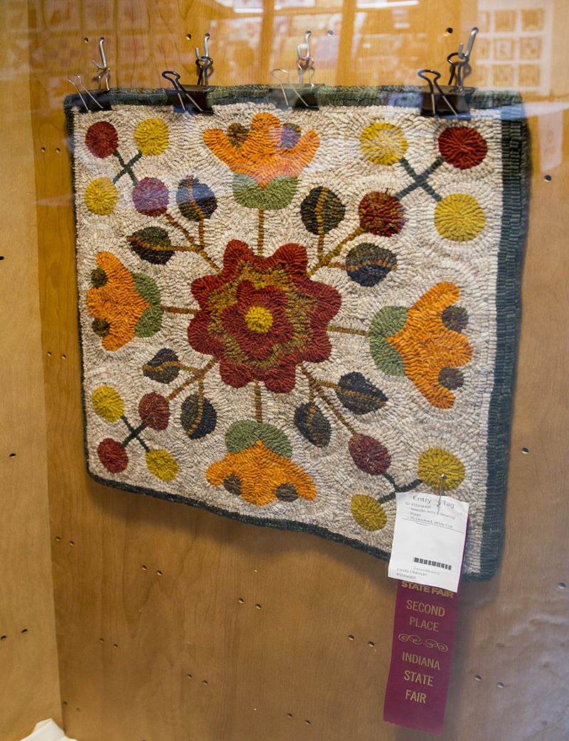 Linda Ohlman 2nd place ribbon for her hooked rug