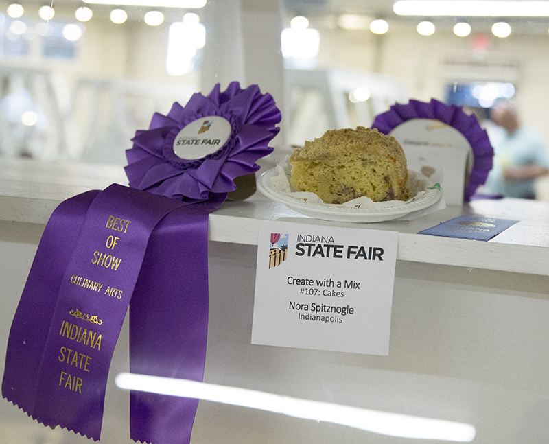 Nora Spitznogle's 1st place ribbon and Best of Show ribbon for her cake entry