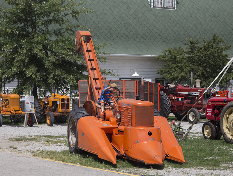 The Fair is a great place to climb on vintage farm implements