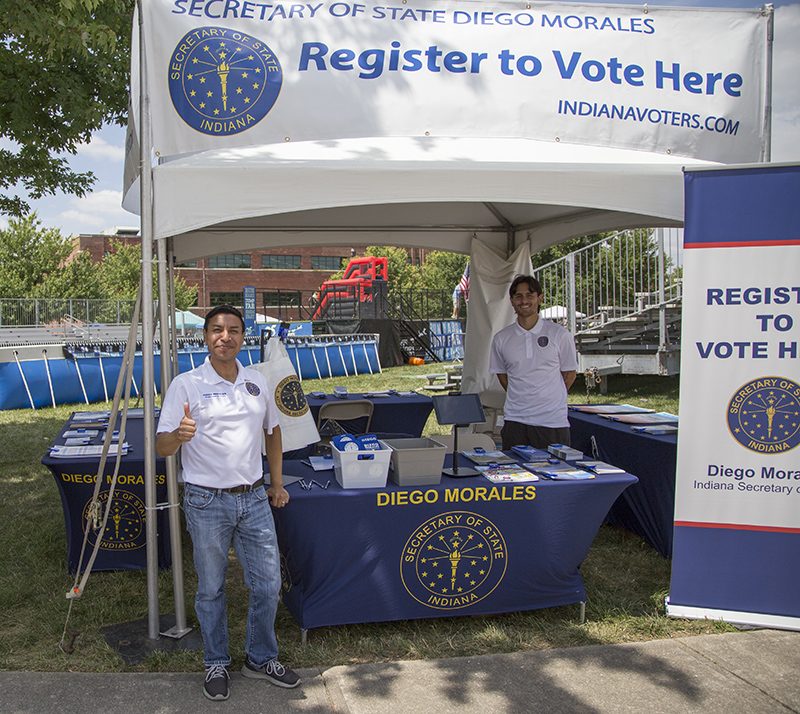 Indiana Secretary of State Diego Morales registering voters at the Fair