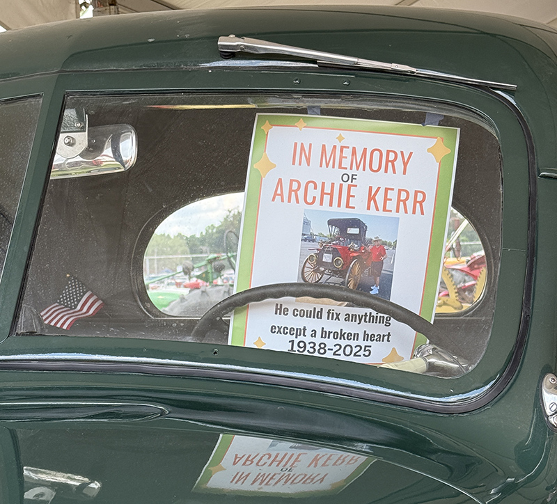 This picture was sent in by Nora Spitznogle. It pays tribute to long-time State Fair participant (and your editor's cousin) Archie Kerr. Archie could be found each year in the Tractor Parade and in the Pioneer Village Building at the Johnson Cabin.