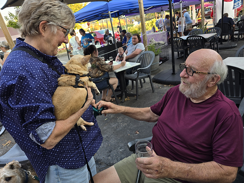 Nancy and John Hill with one of the dogs from Tails and Ales