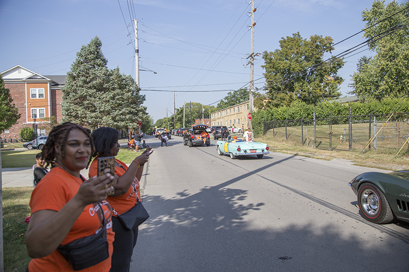 Alumni watching the parade pass by on 61st Street