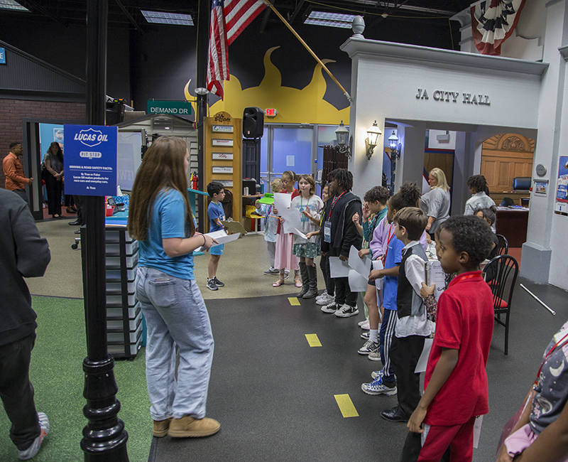 The Mayor and the CEOs of the BizTown businesses lined up to give speeches at the ribbon cutting.