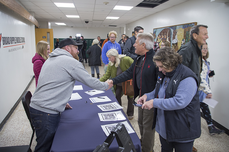 Attendees checking in