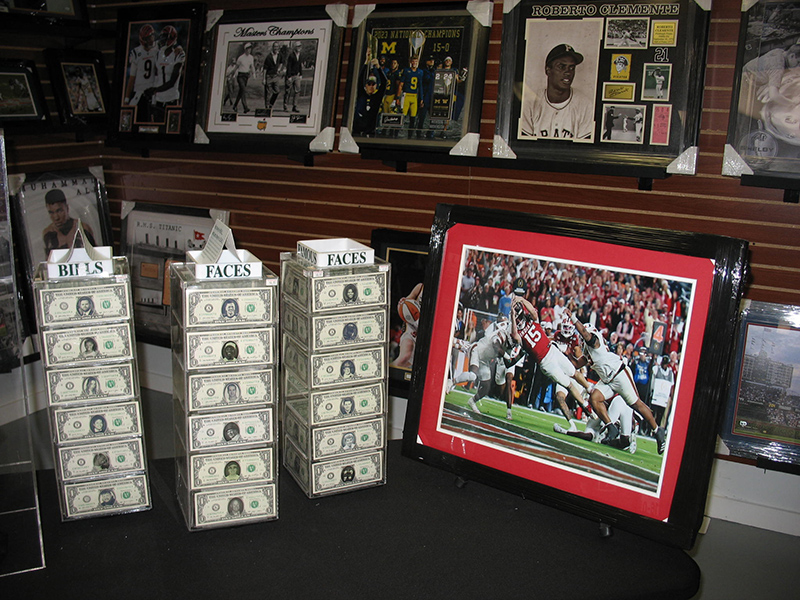 Some novelty dollar bills for sale at Collector's Den.