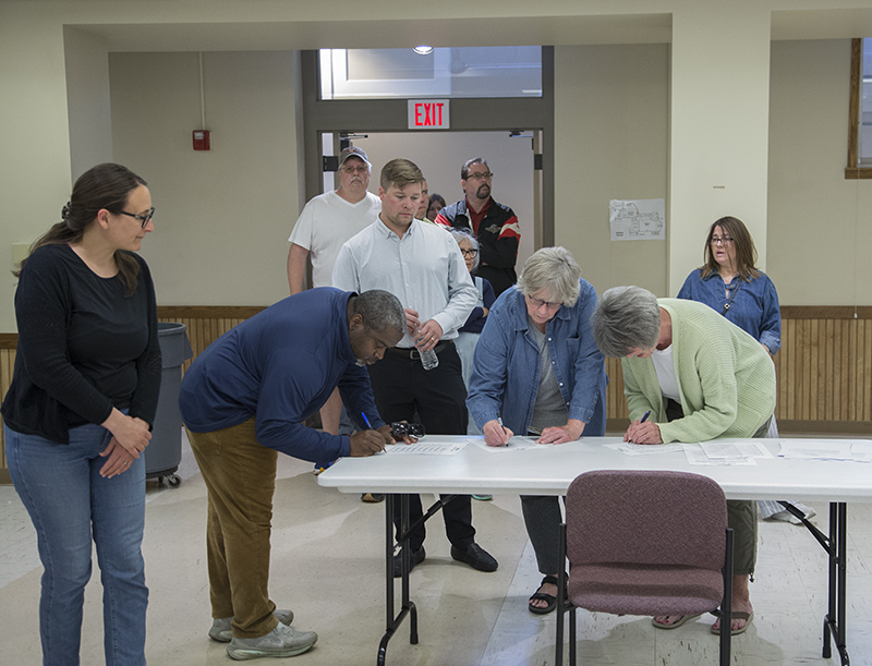 Residents lined up to sign in