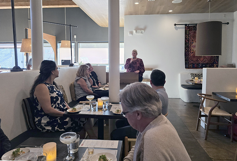 Nicole Harlan-Oprisu welcomed attendees to the dinner