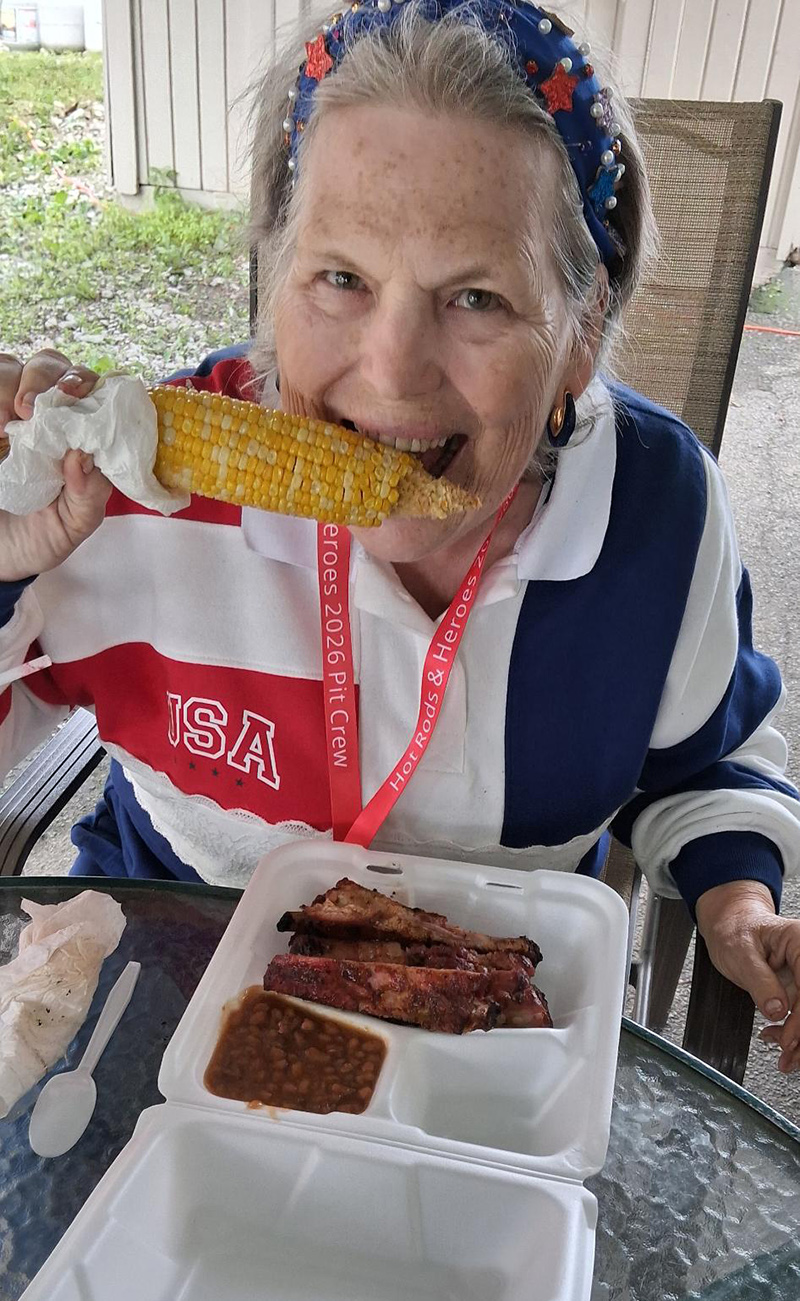 Random Ripplings' own Peggy Russell enjoying St. Louis Ribs, Baked Beans and Corn on the Cob.