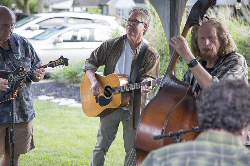 Kevin Strunk on mandolin, Aaron Stroup on guitar, Dean Metcalf on bass