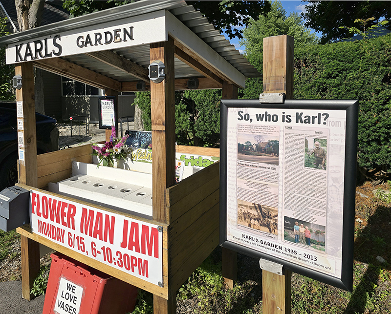 The Gazette's 2005 article on Karl is displayed by the flower stand.