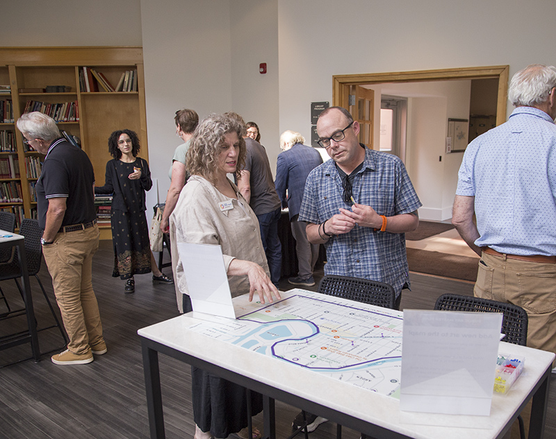 Julia Money Moore discussing the future art location exercise with City-County Councillor John Barth