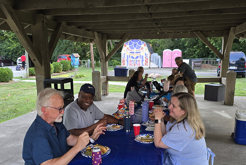Kent Dicken, Darnell Booker, and Mary Dicken at the event.