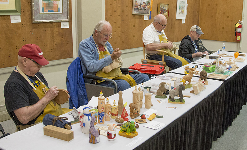 Four carvers hard at work