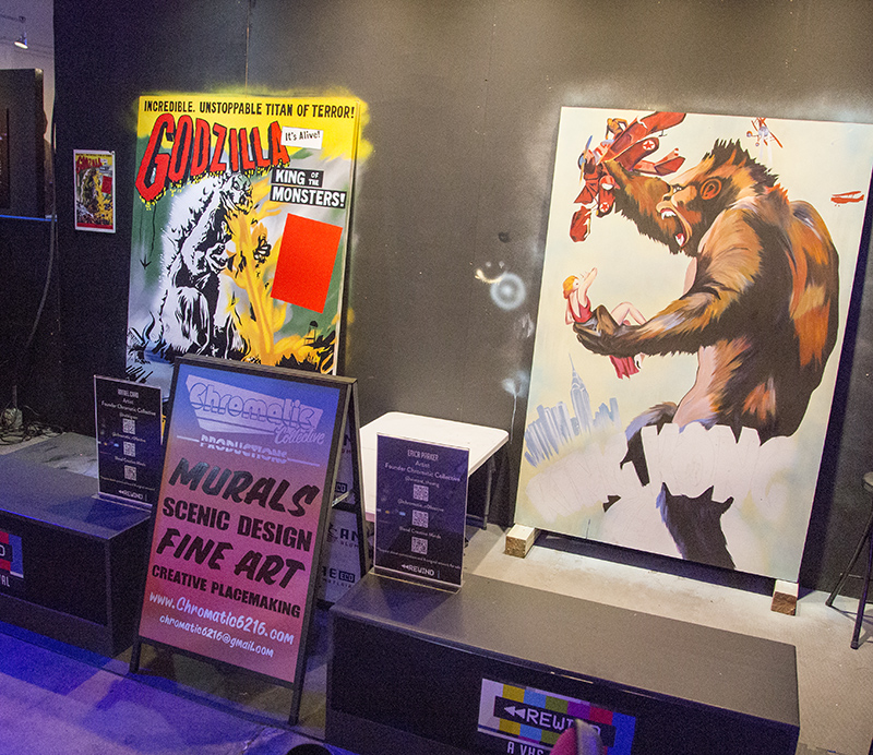 In the VHS Rewind Exhibit - Chromatic Collective (once in the Village on Carrollton) is painting murals at the event.